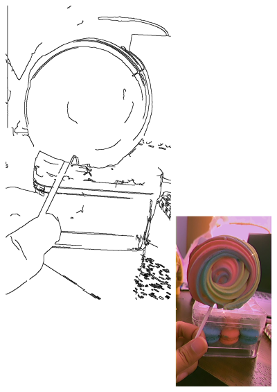 A person is holding a colorful rainbow lollipop in front of a clear box filled with macarons. Sweet treats and candy delights.