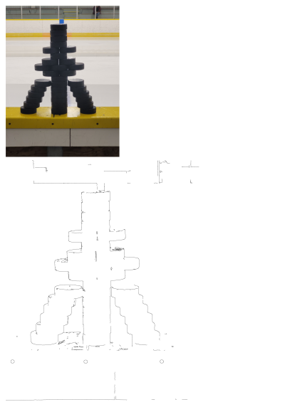 Puck tower inspiration, Turm. Creative tower built with stacked hockey pucks on the side of an ice rink. A whimsical hockey image.